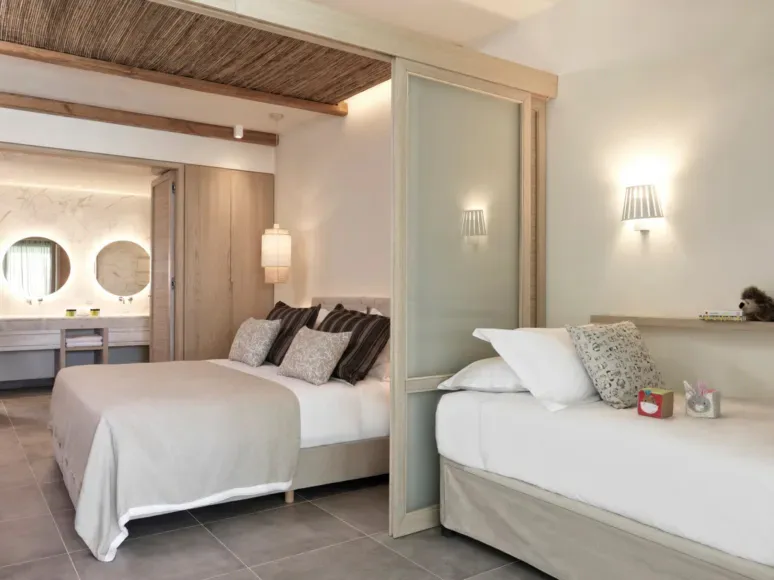 atlantica-dreams-resort-gennadi-family-room-slidings-door-pool-view_13762