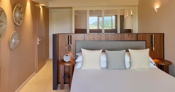 baia-di-chia-resort-sardinia-curio-collection-by-hilton-italy-king-deluxe-family-connecting-rm-lagoon-view_12444