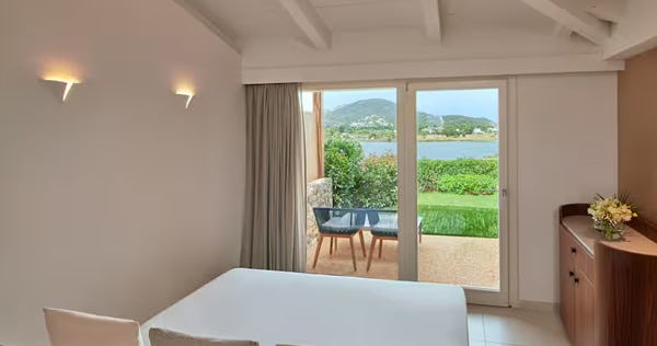 baia-di-chia-resort-sardinia-curio-collection-by-hilton-italy-king-deluxe-room-with-lagoon-view_12444