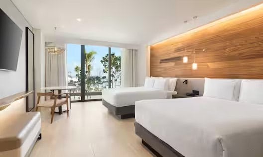 Swim up Pool View Two Queen Beds Guestroom