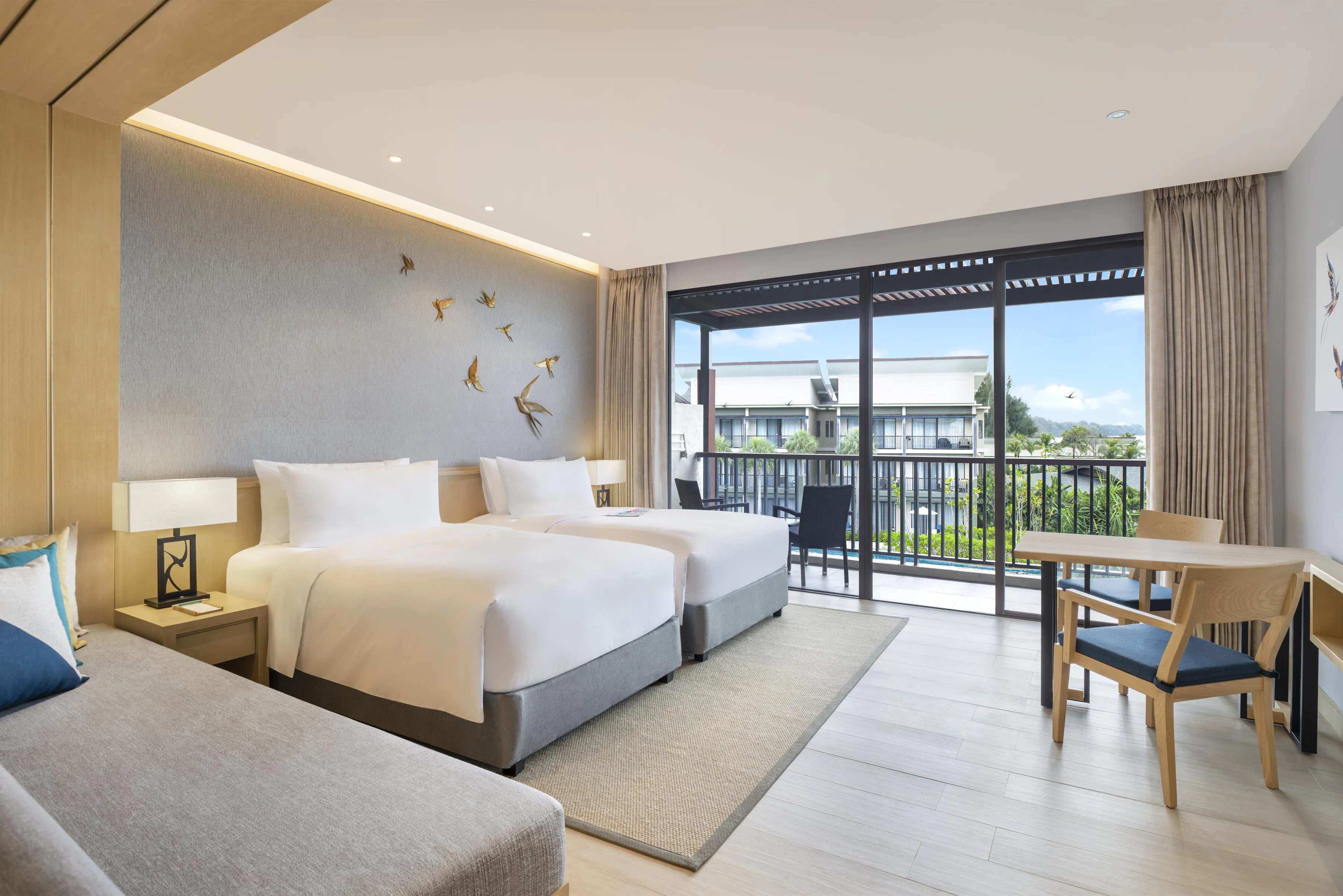 le-meridien-khao-lak-resort-and-spa-larger-guest-room-2-twin-sofa-bed-pool-view_7432