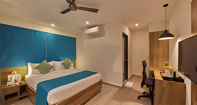 regenta-inn-grand-koramangala-bengaluru-deluxe-room-king-bed-01_13073