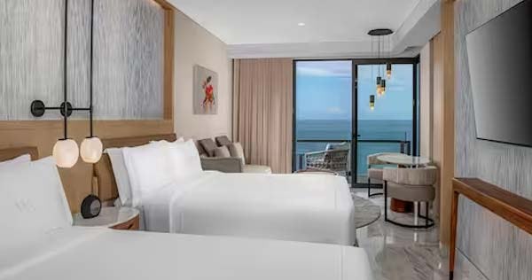 waldorf-astoria-cancun-deluxe-ocean-front-2-queen-beds-guestroom_11640
